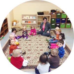 Ms. Casey leads the toddlers in circle time.